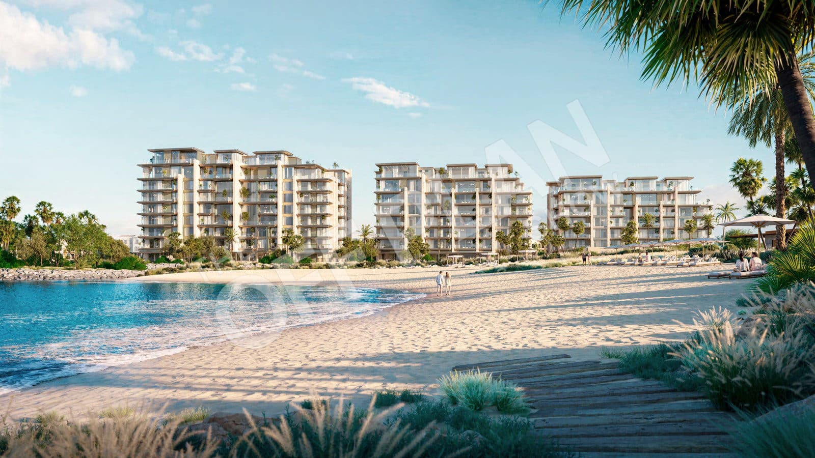 Three Solaya buildings behind a white sand beach and boardwalk